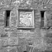 Scanned image of Eilean Donan Castle.
Detail of MacRae Gilstrap Arms above portcullis.