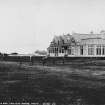 View of Royal Troon Golf Club.
Titeld: 'Golf Club House and Grosbie Tower, Troon. J.V. 21648'