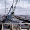 View north of erection of main span suspended structure with two deck panels positioned in each roadway.
Copy of original 35mm colour transparency
Survey of Private Collection