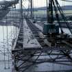 General view of erection of the south section of main span suspended structure. View north from mid-span.
Copy of original 35mm colour transparency.
Survey of Private Collection