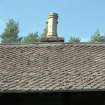 Decorative tiles on S side of roof.