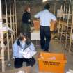 Photograph of RCAHMS staff in the final stages of packing and removing the Whytock and Reid Archive from Whytock and Reid Ltd's former premises on Belford Mews, Edinburgh