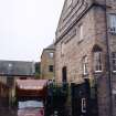 Photograph of the gable end of the former premises of Whytock and Reid, Belford Mews, Edinburgh, taken during the removal of the Whytock and Reid Archive