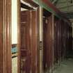 View of row of nine toilet cubicles from SE. Photosurvey 9-OCT-1991