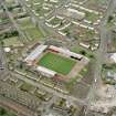Oblique aerial view centred on St Mirren football stadium, Paisley, taken from the SSE.