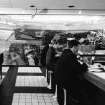 Glasgow Airport, Abbotsinch.
Photographic view of interior showing cafeteria.
Labelled:  'Buffet with Robin Philipson mural'.
Stamped on verso:  'Henk Snoek Claremont Hall 44a Pentonville Road London N.1 Telephone: TER 2533'.
