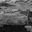 Oblique aerial view centred on the remains of the unenclosed settlement, field system and rig, looking to the NNE.