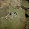 Oblique aerial view centred on the house, the farmsteading and the remains of the castle, Ormiclate, South Uist, taken from the NNW