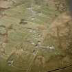 Oblique aerial view centred on the remains of the township, taken from the W.