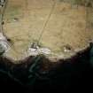 Oblique aerial view centred on Pollachar Inn, South Uist, taken from the SW.