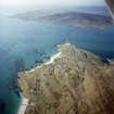 Oblique aerial view centred on the township with the causeway adjacent, taken from the SE.