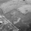 Oblique aerial view centred on the cropmarks of the unenclosed settlement, ring ditch, soutterains and pits at Burnhead of Mondobbo, looking to the NNE.