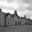 Exterior view from E of "colonies" Railway Workers' housing in Harlaw Rd, King St & Queen St
Photosurvey 17 August 1994