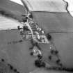 Oblique aerial view centred on church from S.