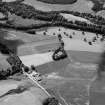 Oblique aerial view centred on the cropmarks of the enclosure and possible ring ditch at Haughs of Ashogle, looking to the SW.