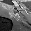 Oblique aerial view centred on the remains of the earthwork,  cropmarks of a rectilinear enclosure and pits at Thomshill with the Glenlossie distillery adjacent, looking to the ENE.