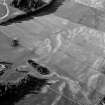 Oblique aerial view centred on the cropmarks of the possible field boundary, looking to the NNE.