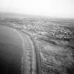 Oblique aerial view centred on Aberdeen beach, groynes and amusement park, looking to the S.