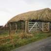 View of thatched cottage.