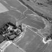 Oblique aerial view centred on the cropmarks of the unenclosed settlement, ring ditches, possible roundhouses and pits at Auldtown of Netherdale, looking to the E.