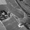 Oblique aerial view centred on the cropmarks of the unenclosed settlement, ring ditches, possible roundhouses and pits at Auldtown of Netherdale, looking to the ENE.