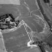 Oblique aerial view centred on the cropmarks of the unenclosed settlement, ring ditches, possible roundhouses and pits at Auldtown of Netherdale, looking to the ENE.