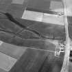 Oblique aerial view centred on the cropmarks of a rectlinear enclosure, possible souterrains, pits and rig at Chapel Knap, looking to the SSE.