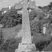 Digital copy of photograph of latin cross with two stepped base commemorating John Lawerence Gardiner, 1923 and his wife Katharine Eliza Aitkan, died 1947.  
Survey no. 9