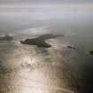 General oblique aerial view looking towards the Shiant Islands, taken from the NW.