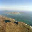 General oblique aerial view centred on the Island with the causeway and village adjacent, taken from the NW.