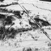 Oblique aerial view centred on the remains of the ring cairn and field system at Monandavan, looking to the NNW.