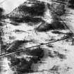 Oblique aerial view centred on the remains of the ring cairn and field system at Monandavan, looking to the WSW.