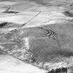 Oblique aerial view centred on the remains of the fort and rig and furrow at Barra Hill, looking to the NNW.