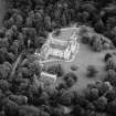 Oblique aerial view centred on Fyvie Castle with the racquets court adjacent, looking to the ENE.