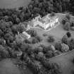Oblique aerial view centred on Fyvie Castle with the racquets court adjacent, looking to the NE.