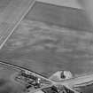 Oblique aerial view centred on the cropmarks of the pit alignment, pit enclosure, possible barrows and rig at Inchbare, looking to the ESE.
