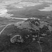 Oblique aerial view centred on the remains of the fort at Mither Tap of Bennachie, looking to the SE.