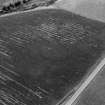 Oblique aerial view centred on the cropmarks of the circular enclosure at Barflat, looking to the SE.