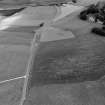 Oblique aerial view centred on the cropmarks of the circular enclosure at Barflat, looking to the NNE.
