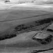 Oblique aerial view centred on the remains of the motte and bailey at Peel of Fichlie, looking to the S.