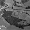 Oblique aerial view centred on the remains of the castle and motte of Doune of Invernochty, looking to the ESE.