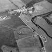 Oblique aerial view centred on the remains of the castle and motte of Doune of Invernochty, looking to the ENE.