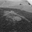 Oblique aerial view centred on the remains of the bivallate fort of Barmkyn of North Keig, looking to the W.