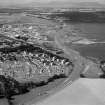 General oblique aerial view centred on Inverness and the Kessock Bridge under construction, looking to the NW.