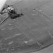 Oblique aerial view centred on the cropmarks of the ring ditches, enclosures and pits at Newbarns, looking to the SW.