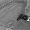 Oblique aerial view centred on the cropmarks of the ring ditches, enclosures and pits at Newbarns, looking to the ESE.