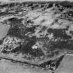 Oblique aerial view centred on the remains of the enclosure at Hill of Keir, looking to the NW.