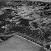 Oblique aerial view centred on the remains of the enclosure at Hill of Keir, looking to the NW.