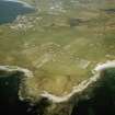 Oblique aerial view centred on Aird crofting township with Balivanich village, Benbecula, adjacent, taken from the W.