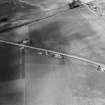 Oblique aerial view centred on the cropmarks of the Roman Temporary Camp, ring ditches, enclosure, lienar features, pits and rig at Dun and Gilrivie, looking to the NNE.